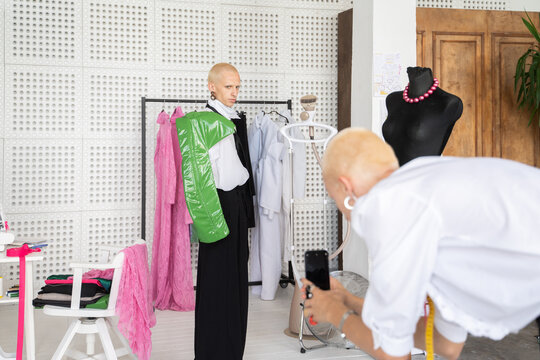 Taking Photo Using Phone At Fashion Studio