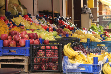 Colored fruits and vegetables at a grocery store. New season foods