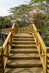 Old wooden bridge with stairs in park