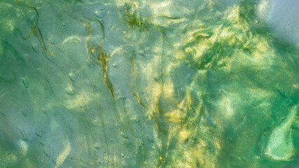 Fototapeta na wymiar Abstract textured neon background transparent slime,Liquid art gel background.