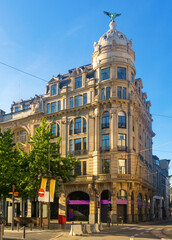 Fototapeta premium Scenic view of Antwerp summer cityscape overlooking monumental baroque office building crowned with a dome and eagle sculpture on corner of Meir and Huidevettersstraat streets, Belgium.