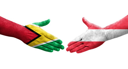 Handshake between Austria and Guyana flags painted on hands, isolated transparent image.