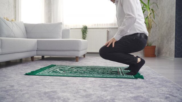 Muslim man praying at home.
Muslim man prostrates to Allah.

