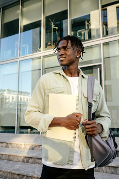 Black student near university building