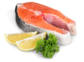 Fresh raw salmon with salt and lemon on white background