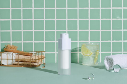 single skincare sprayer on light turquoise table