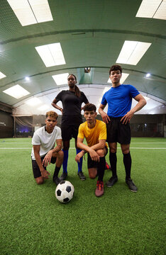 Diverse football players on football pitch