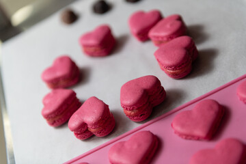 Red Heart Macarons Dessert on Baking Parchment Paper