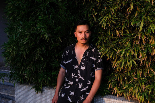 Handsome Asian Man With Tropical Background