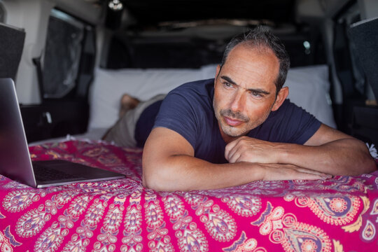 young man in camper van