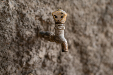 Grunge Metal Water Faucet. Rusted iron water tap.