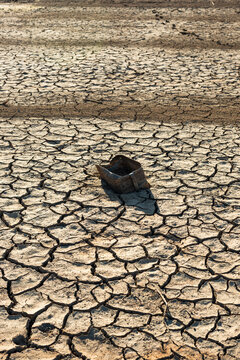 Cracked soil in dried up dam, climate change