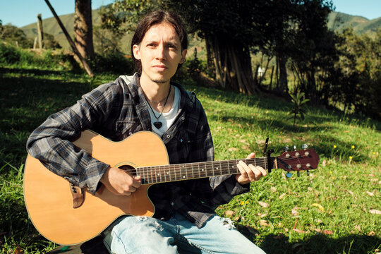 Portrait of a guitarist outdoors