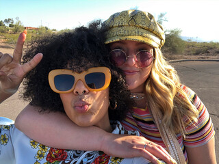 User-Generated Content Selfie of two Best Friend peace sign with hat