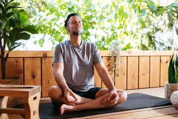 Man breathing fresh air during meditation session