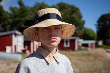 Fototapeta premium Scandinavian child in wide brimmed hat