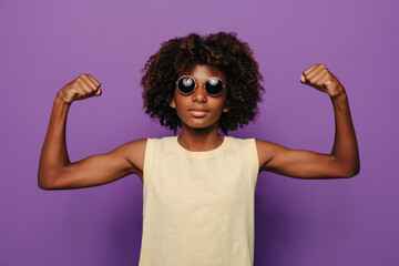 Stylish black child in sunglasses