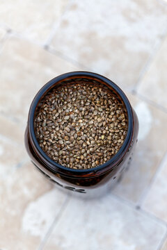 Cannabis seeds in amber glass jar