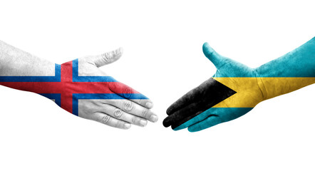Handshake between Bahamas and Faroe Islands flags painted on hands, isolated transparent image.
