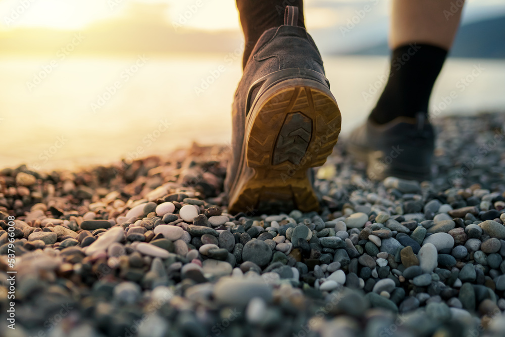 Wall mural person walking on the beach