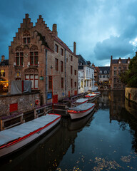 Brugge Belgium canal and boats at night