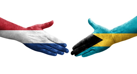 Handshake between Bahamas and Netherlands flags painted on hands, isolated transparent image.