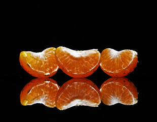 tangerines on black background