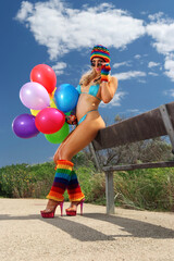 Sexy bikini girl with colorful balloons