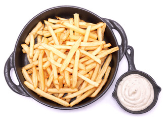 French fries potatoes in black ceramic bowl isolated on white background