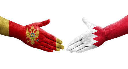 Handshake between Bahrain and Montenegro flags painted on hands, isolated transparent image.