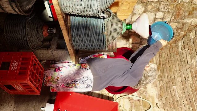 local senior farmer red wine filtering fining to finishing before bottling