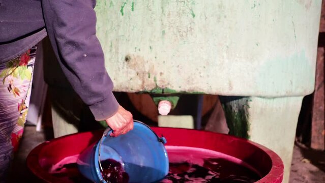 local senior farmer red wine filtering fining to finishing before bottling