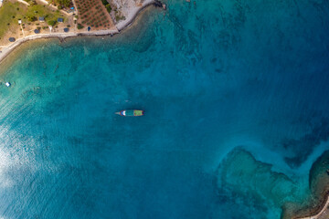 Photo of a boat taken with a drone in the middle of the sea, Turkey, myrtle