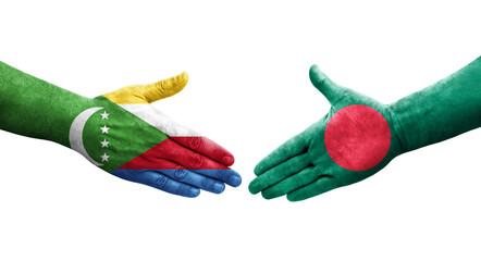 Handshake between Bangladesh and Comoros flags painted on hands, isolated transparent image.