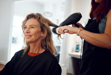 Hair care, hairdresser and senior woman client hair treatment, professional salon service and hairdryer. Small business, elderly female and brush modern hairstyle, happy customer and beautician lady.