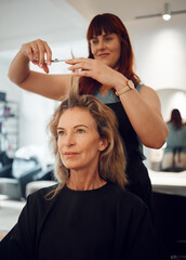 Woman, hair and salon for haircut with hairdresser for beauty, style or makeover. Customer, beautician and cosmetics for professional hair care, service or fashion in studio, spa or shop in Toronto