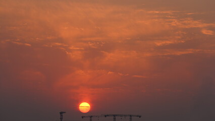 Fototapeta premium The beautiful sunset view with the colorful clouds and sky in the city