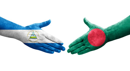 Handshake between Bangladesh and Nicaragua flags painted on hands, isolated transparent image.