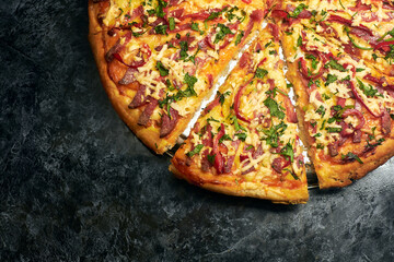 Round pizza cut on one side. Stock photo