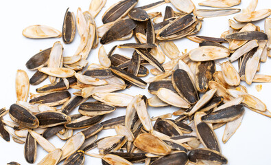 Helha from sunflower seeds on a white background. Purified cake from oil production.