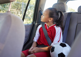 Child in car interior, travel transport to football and soccer athlete sitting in motor vehicle....
