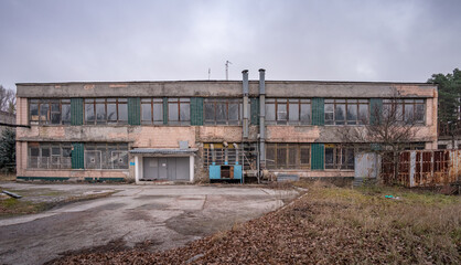 Fototapeta na wymiar An facade of abandoned laundry in the Prypiat city, Ukraine.