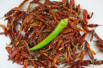 dried red pepper and one fresh green