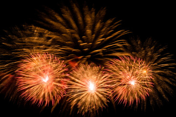Close-up of colorful fireworks on a black background.