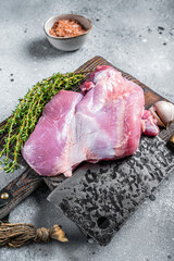 Poultry fresh meat, Raw Turkey thigh fillet on wooden cutting board. Gray background. Top view