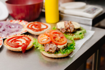 The process of making a burger. Ingredients for making a burger. Everything you need to make a burger is laid out on the table.