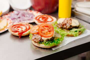 The process of making a burger. Ingredients for making a burger. Everything you need to make a burger is laid out on the table.