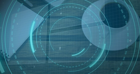 Image of scope scanning with 5g text and data processing over desk with laptop