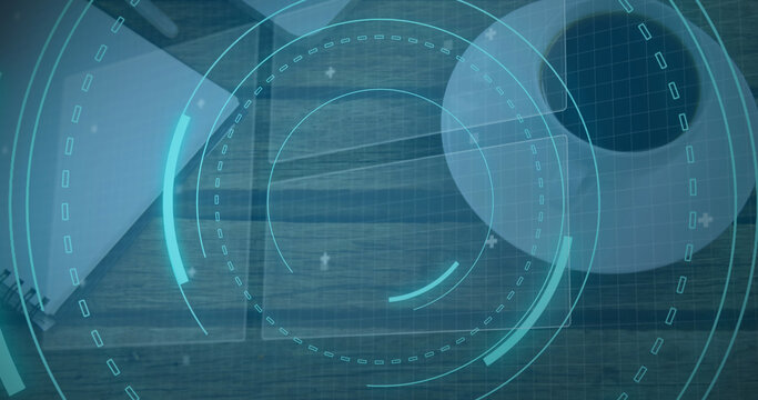 Image of scope scanning with 5g text and data processing over desk with laptop