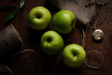 green apples on a wooden table